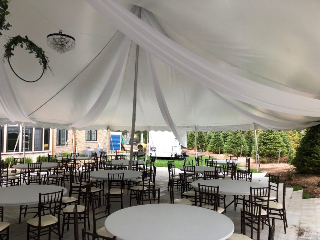 Bride decorated under our 40 x 80 White Tension Tent (we do not own these tables or chairs)